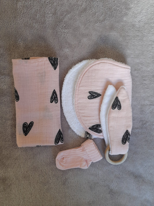 Muslin gift set F1 – set of 4 - Pale pink with black hearts. Muslin, Socks, Wooden ring and Baby burp cloth.